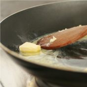 melt butter in pan for fish cooking